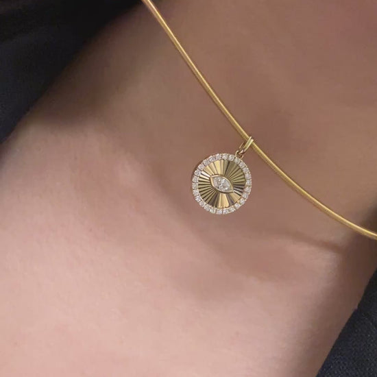 Guesthouse Meridian choker necklace in real life styled on a lady's neck with a pendant cut in Guilloche style.